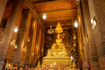 Fototapeta na wymiar The principal Buddha images of Wat Pho or Phra Chetuphon Wimon Mangkararam Temple an ancient temple in Bangkok, Thailand