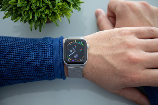 Man Hand With Apple Watch Series 4 Over The Table