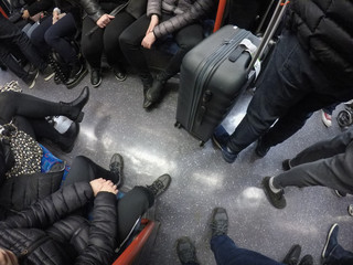 passengers feet on a London Underground train