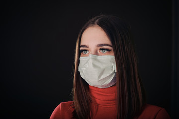 Flu cold or allergy symptom. Sick young woman sneezing in mask isolate on black background. Health care. Studio shot. Business woman wears a mask and coughing, Free from copy space.