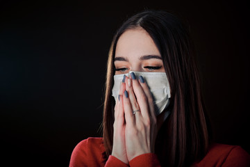 Flu cold or allergy symptom. Sick young woman sneezing in mask isolate on black background. Health care. Studio shot. Business woman wears a mask and coughing, Free from copy space.