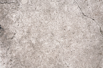 Close up shot of grey stone surface with cracks and potholes. Natural Wallpaper, Texture, Pattern, Backgrounds.