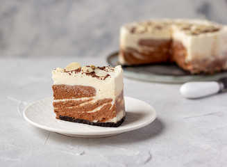 A piece of homemade raw chocolate cheesecake or mousse cake