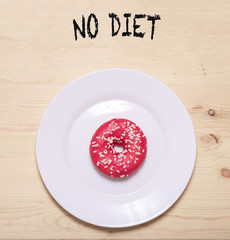 doughnut is on  white plate, the concept is no diet