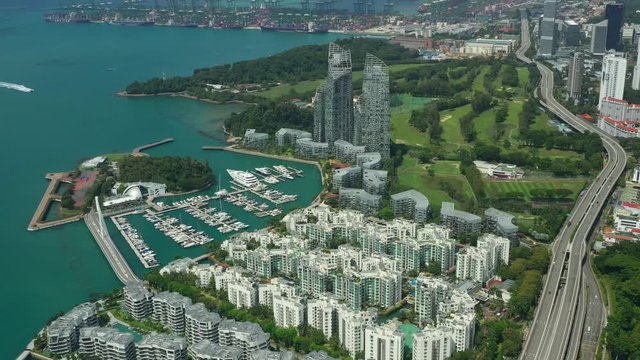 sunny day singapore city apartment complex yacht dock marina port bay aerial panorama 4k 