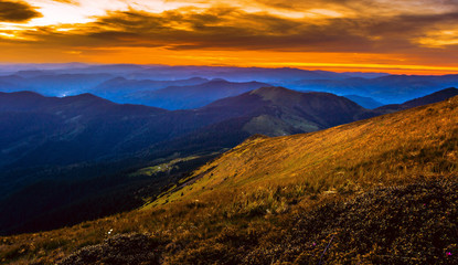 panoramic nature scenery, attractive mountains scene, stunning summer dawn landscape, hills mountains covered forest on background morning valley in golden sunlight and dramatic sky, Ukraine, Europe