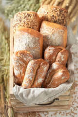 Homemade and brown buns in old wooden box