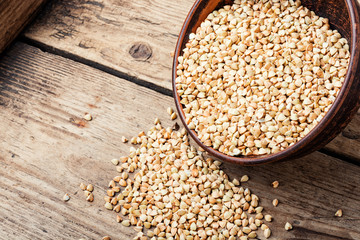 Green buckwheat on wooden table