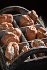 Crunchy buns for healthy breakfast in wooden box