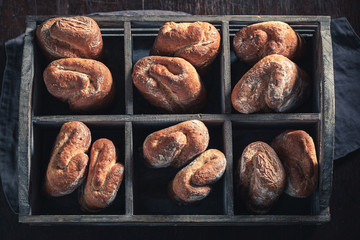 Brown buns for tasty breakfast in wooden box
