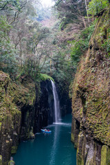Obraz premium Waterfall and boat