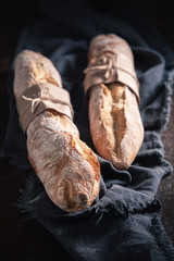 Closeup of french baguettes on dark table