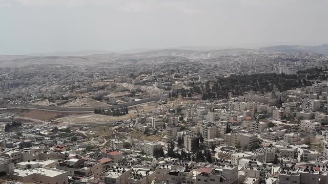Separation security wall Israel Palestine, Jerusalem neighborhoods, pan left