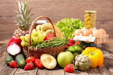 assorted of dairy product, fruit, vegetable on wood background