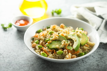 Healthy quinoa bowl with soy beans and avocado