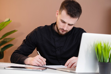Man working at the office on laptop