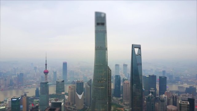evening time shanghai cityscape pudong downtown megatalls aerial panorama 4k tilt shift china