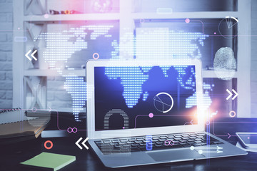 Multi exposure of table with computer and world map hologram. International data network concept.