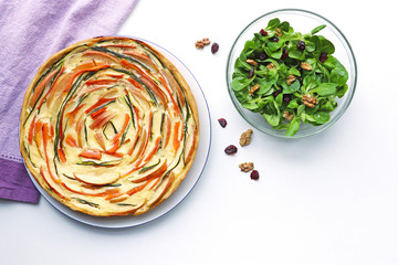 vegetable pie and lambs lettuce, top view