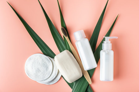Zero waste, sustainable bathroom and lifestyle. Bamboo toothbrush, natural soap bar, cotton make-up removal pads, homemade DIY beauty products in reusable bottles