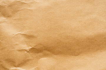 Fototapeta na wymiar Brown crumpled paper recycled kraft sheet texture background