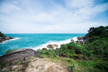 Beautiful tropical landscape with rocks, blue sky, turquoise sea and green plants. Holidays and tourism concept.