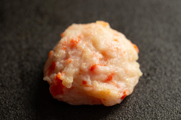 fish cake on black background 