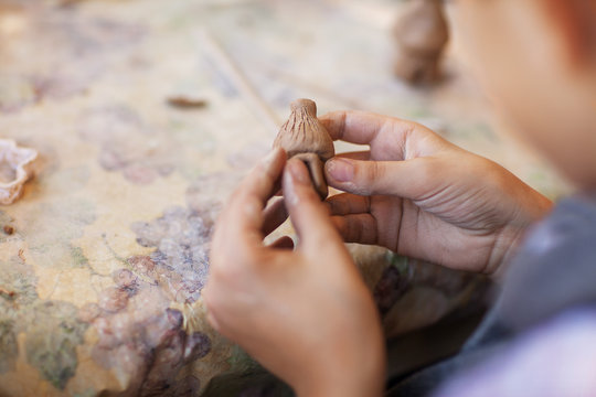 Children Make Clay Figures By Pottery