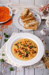Carrot lentils cream with bacon