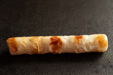 fish cake on black background 