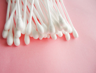 cotton swabs on pink background , ear sticks 