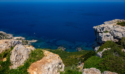 Fototapeta na wymiar Green mountainous coast of the Mediterranean Sea on the Akamas Peninsula in the northwest of the island of Cyprus.