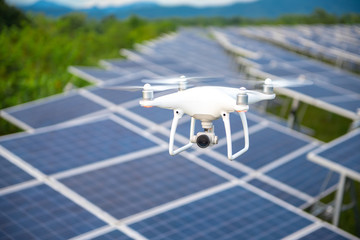 Drones and solar cells, The drone is a high angle camera shooting a solar cell farm. Which is clean...