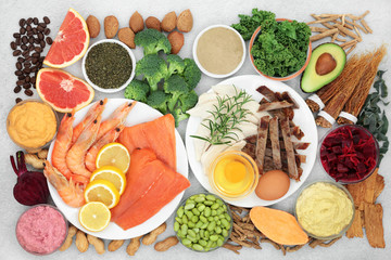 Health food and chinese herbs for vitality & fitness with foods high in vitamins, minerals, anthocyanins, antioxidants, smart carbs, protein & omega 3. Flat lay rustic wood.