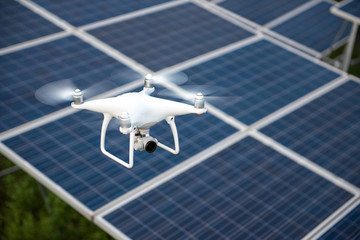 Drones and solar cells, The drone is a high angle camera shooting a solar cell farm. Which is clean energy Able to generate electricity