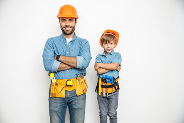 Merry father and son with hand instruments stock photo