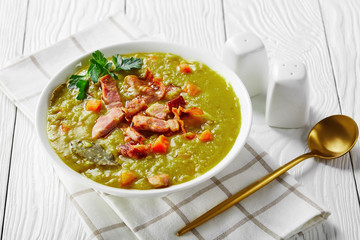German split pea soup on a white wooden background