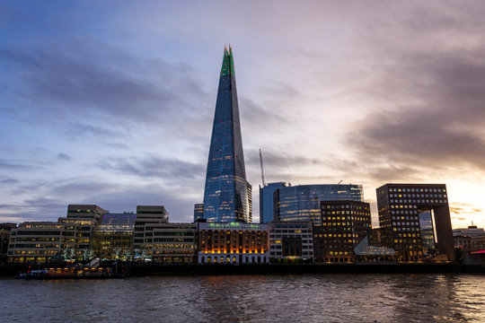 The Shard and other buildings lit at the river Thames