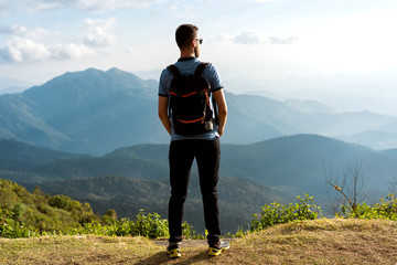 tourist guy stands on the edge of the mountains in thailand © Rock and Wasp