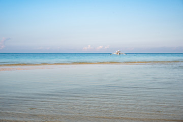 A lone fishing boat at the shore of Boracay, Philippines