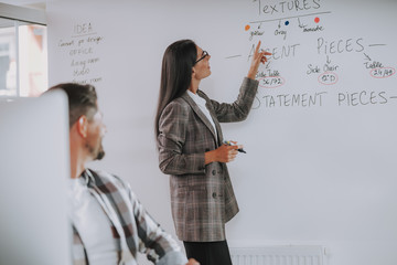 Man looking on information on wall in the office