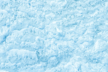 blue texture of an snow surface with pure white wave , blue cold clear cryslallized wall background ,decorative plaster background close up , abstract macro wallpaper