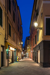 Fototapeta na wymiar Night view of Alassio narrow street, Italian Riviera