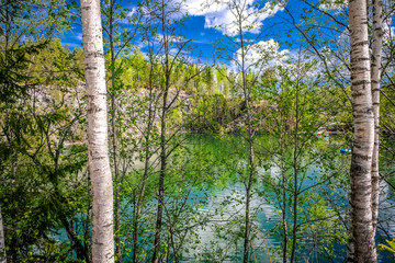 Fototapeta premium Ruskeala Mountain Park - a centuries-old history of mining. The indescribable beauty of natural marble in the wild. Karelia. Russia.