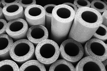 Black & white construction foam tubes background