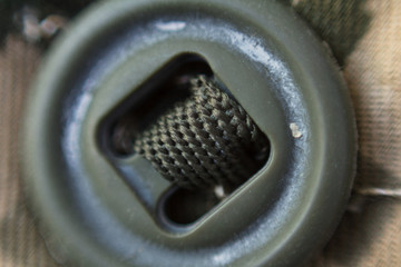Military uniforms , button closeup, Camouflage background texture, Close up of military uniform surface
