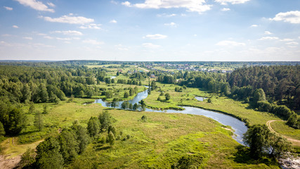 Fototapeta na wymiar Field and river Usherka near Sudogda in summer, shooting from a quadcopter. Russia, Vladimir region