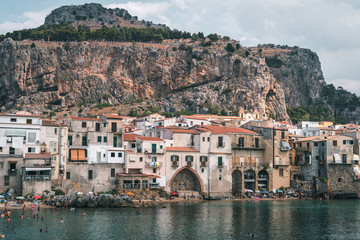 Fototapeta na wymiar Cefalù, Sicily, Italy - August 22, 2019. Tourists visiting Cefalù, an old fishing village in Sicily
