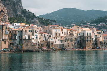 Fototapeta na wymiar Cefalù, Sicily, Italy - August 22, 2019. Tourists visiting Cefalù, an old fishing village in Sicily