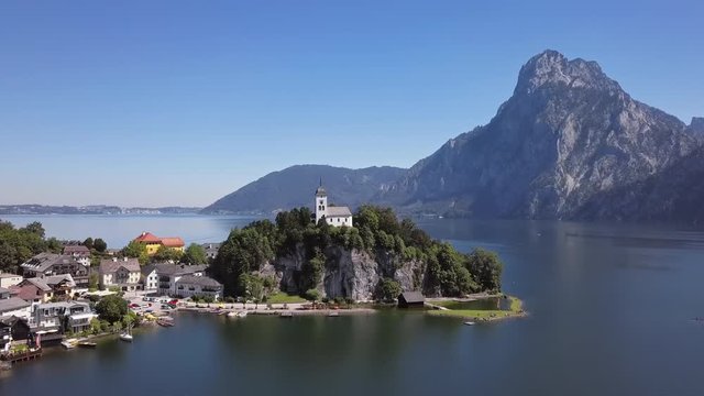 Flight over of Traunkirchen church on Traunsee lake, in Salzkammergut, Upper Austria.